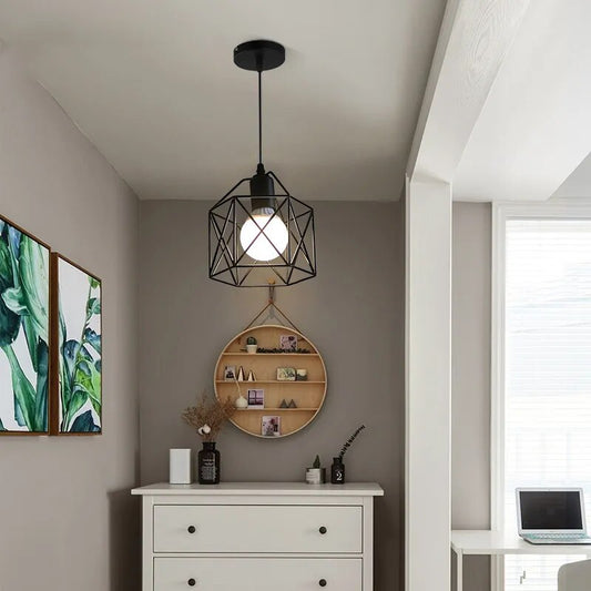 Pendant light with metal cage shade hanging from the ceiling.