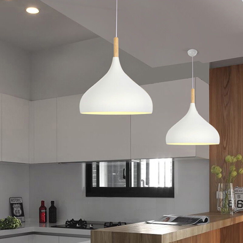 Three wood pendant lights suspended from the ceiling.