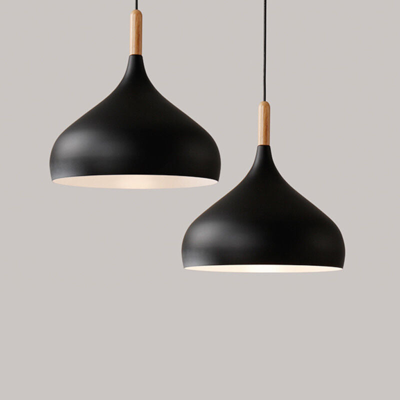 Stylish pendant lamps illuminating a sleek kitchen space.